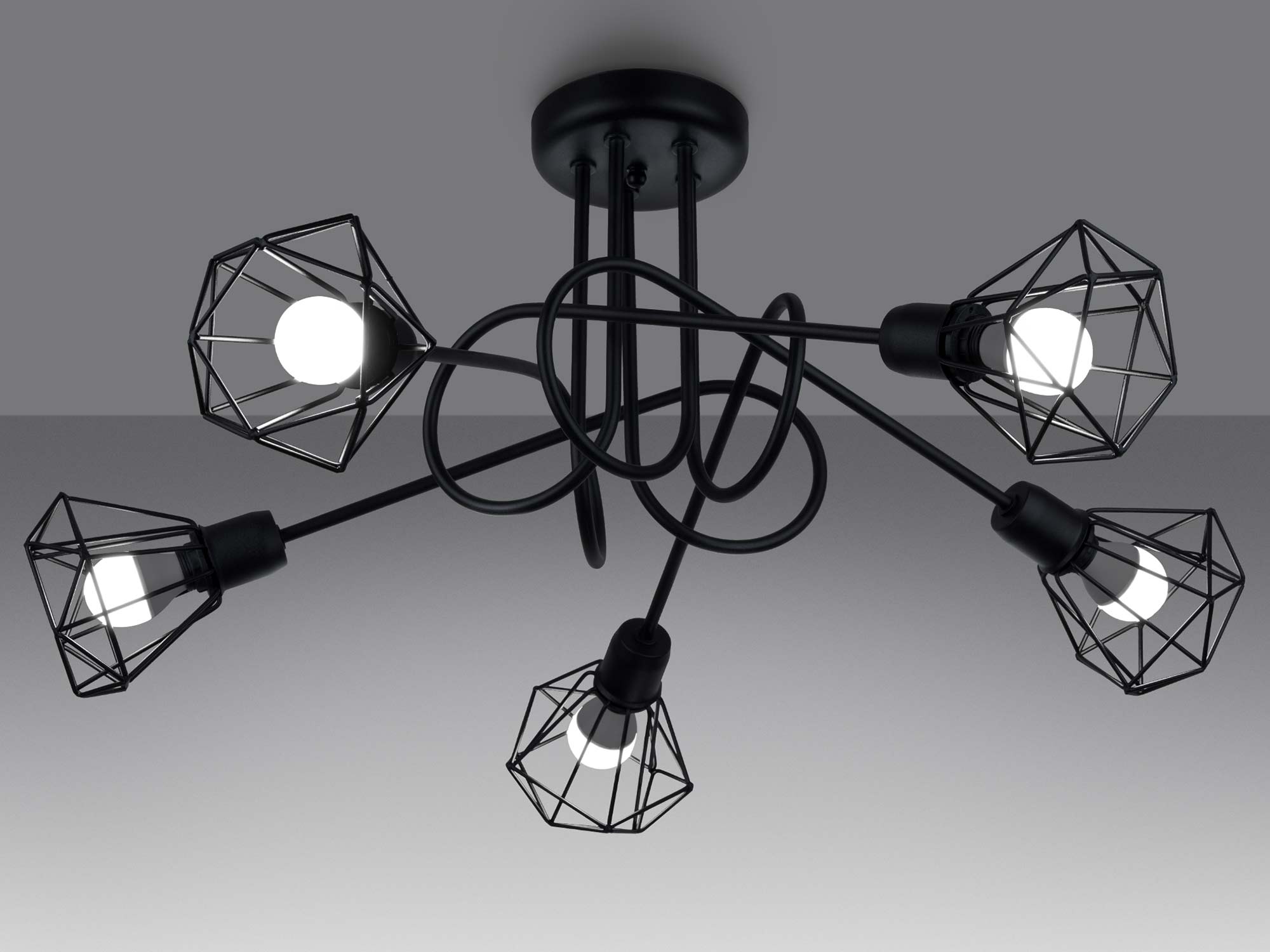 Detal klatkowego kinkietu – zbliżenie na czarną oprawkę i przewód Detal klatkowego kinkietu – zbliżenie na czarną oprawkę i przewód