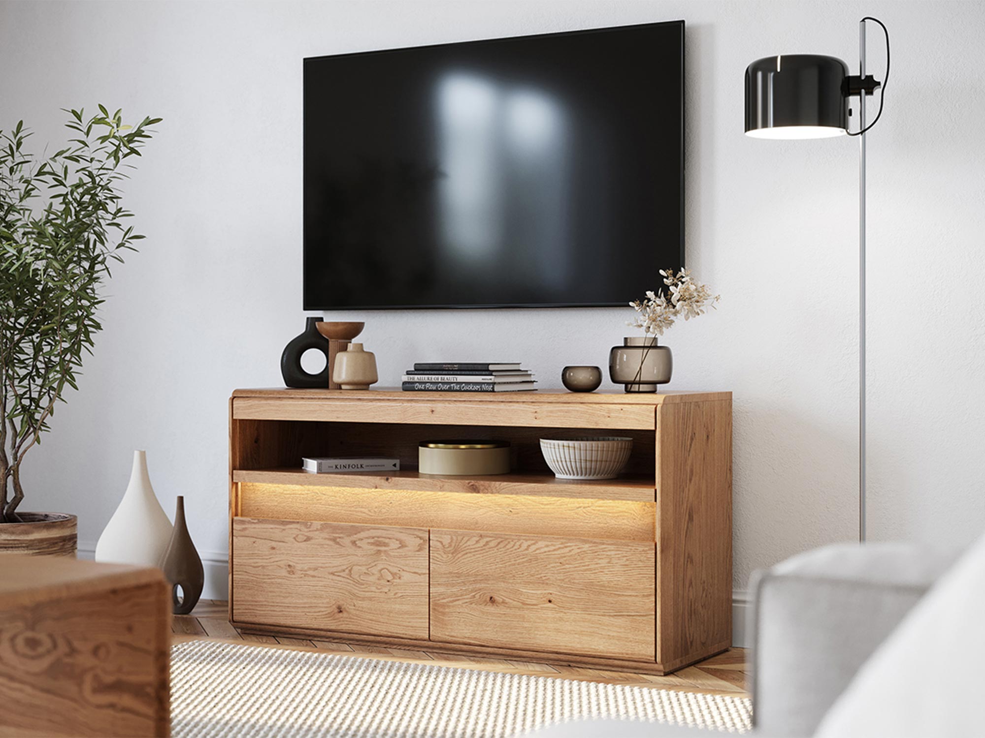 Nowoczesna szafka RTV z litego dębu pod ściennym telewizorem