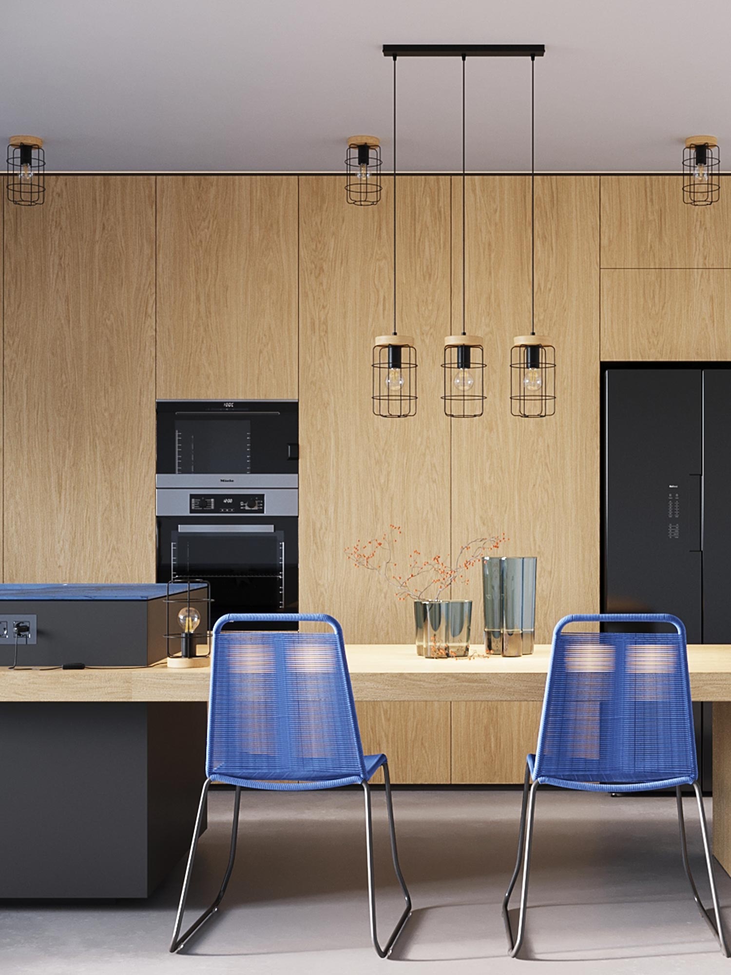 Wnętrze kuchni z wyspą i trzema lampami z metalową siatką Wnętrze kuchni z wyspą i trzema lampami z metalową siatką