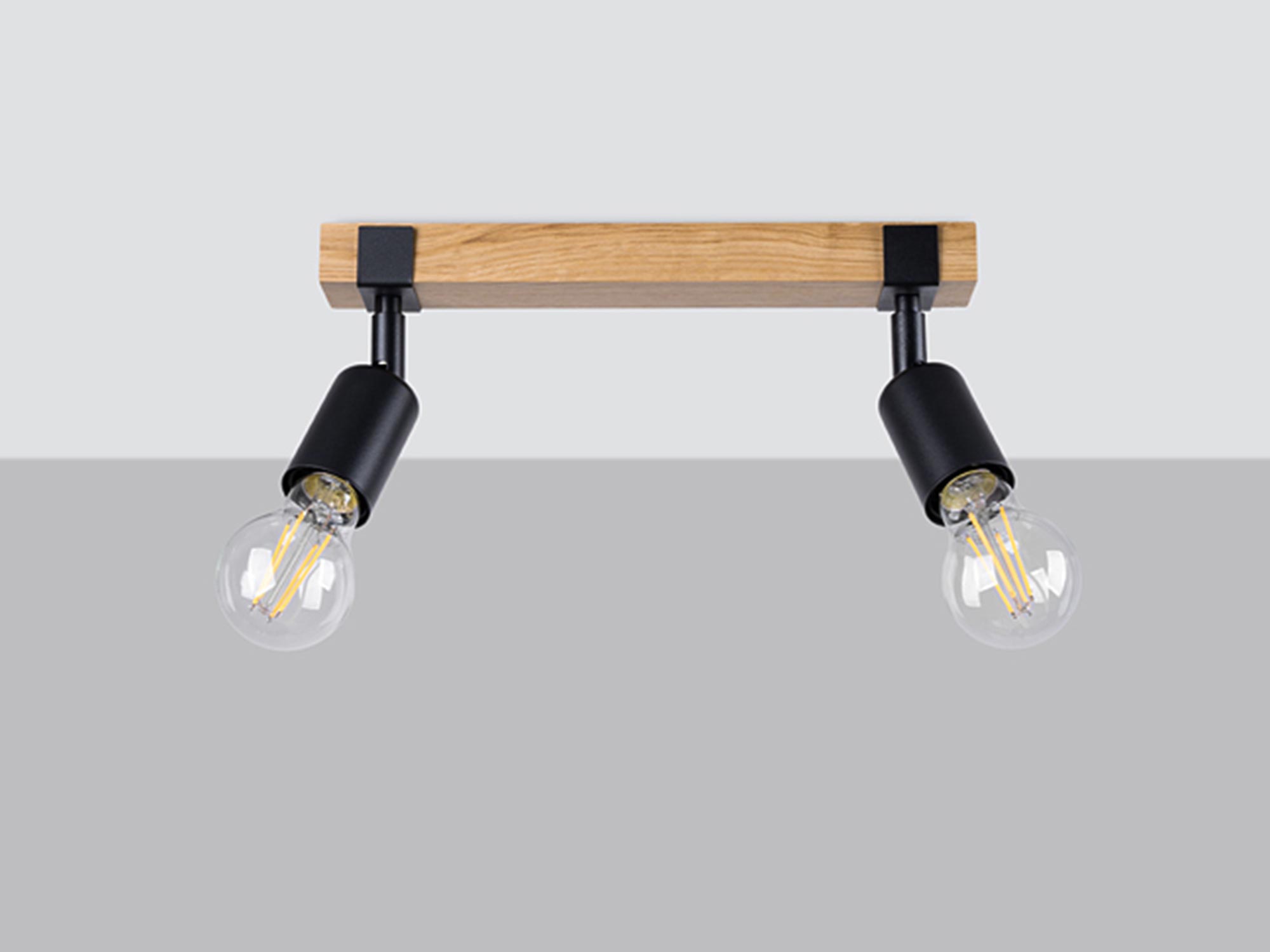 Reflektory na drewnianej listwie – dwa źródła światła na jasnym tle Reflektory na drewnianej listwie – dwa źródła światła na jasnym tle
