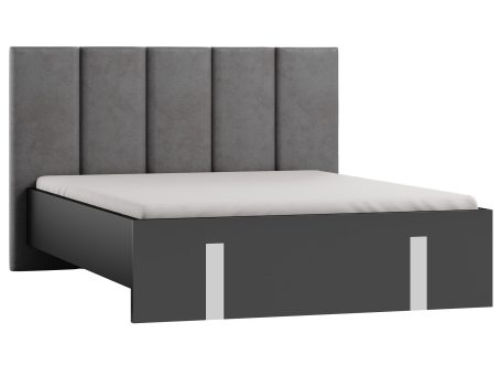 Nowoczesne łóżko z szarym tapicerowanym zagłówkiem