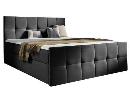 Nowoczesne łóżko tapicerowane w czarnym kolorze z pikowaną ramą