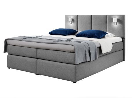 Łóżko kontynentalne w szarym kolorze z prostym zagłówkiem