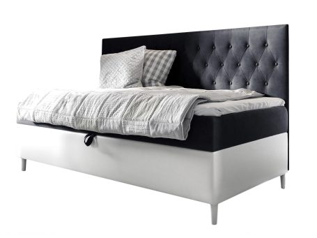 Czarno-białe łóżko jednoosobowe z wysokim pikowanym zagłówkiem