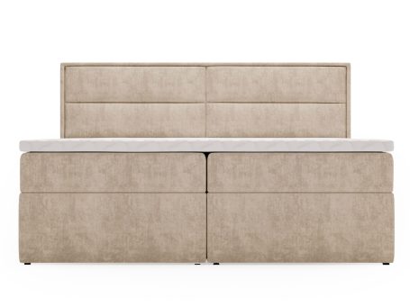 Beżowa sofa o minimalistycznym fasonie z pionowymi przeszyciami