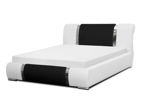 Białe łóżko z czarnym elementem tapicerowanym