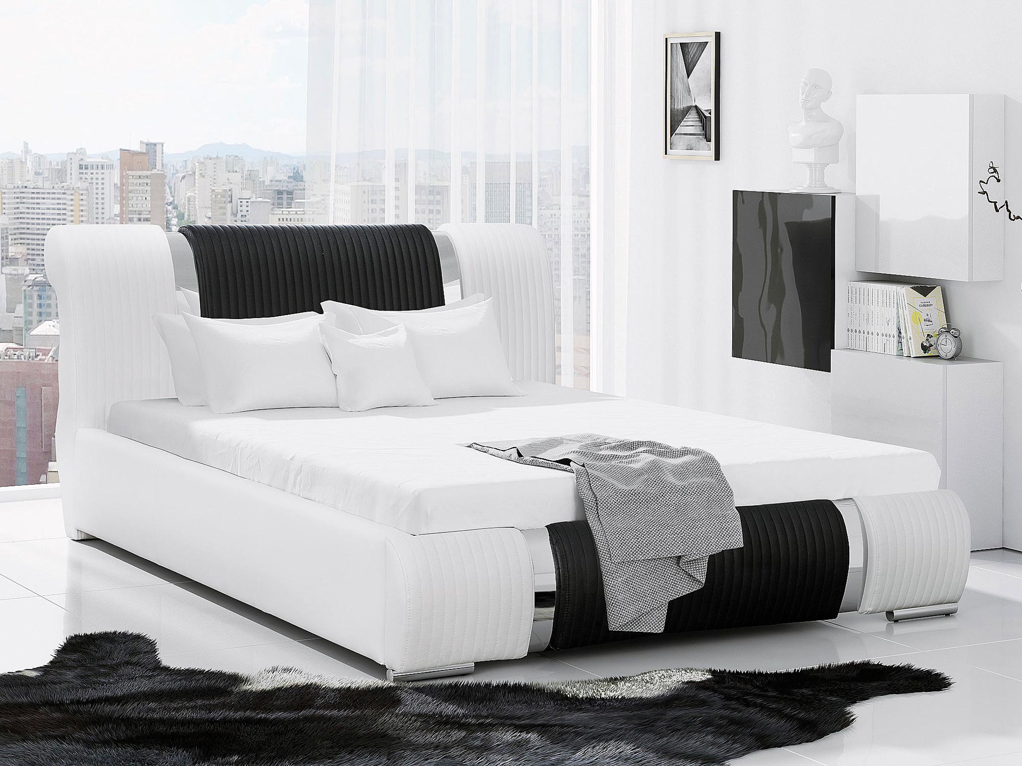 Łóżko tapicerowane w kolorze białym z czarnym akcentem w sypialni Łóżko tapicerowane w kolorze białym z czarnym akcentem w sypialni