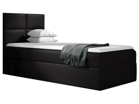 Czarne łóżko z niskim zagłówkiem – nowoczesny, surowy styl.