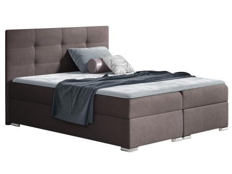 Brązowe łóżko tapicerowane z prostym zagłówkiem i solidną konstrukcją