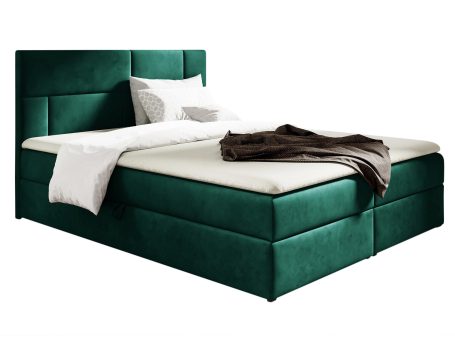 Łóżko tapicerowane w zielonym kolorze z pikowanym zagłówkiem