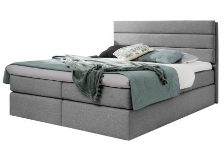 Łóżko tapicerowane w szarym kolorze w stylu skandynawskim