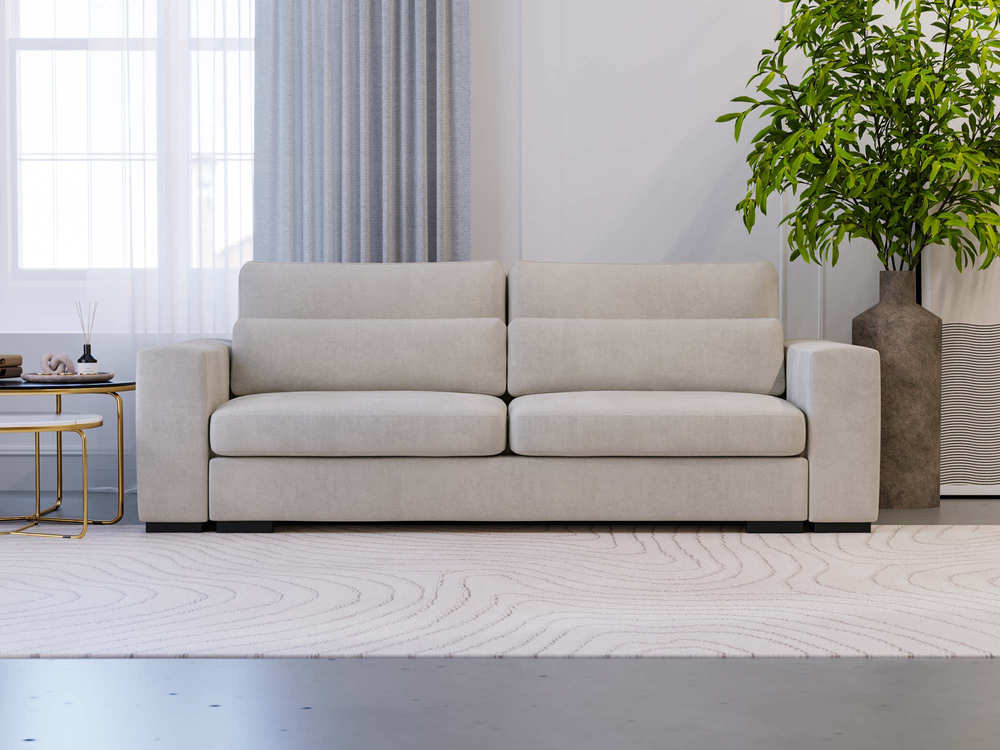 Sofa kremowa tapicerowana z grubymi poduchami do nowoczesnego wnętrza