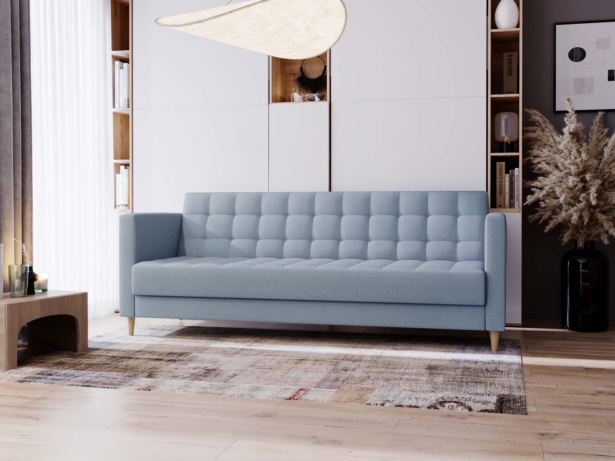 Niebieska sofa z oparciem pikowanym w stylu nordic
