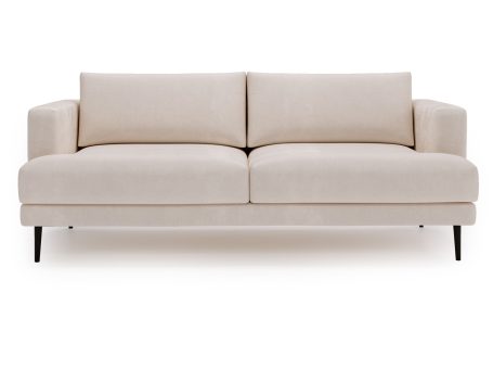 Sofa kremowa tapicerowana z klasycznym przeszyciem