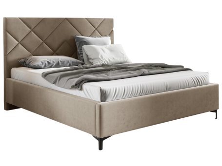 Łóżko tapicerowane w kolorze beżowym z pikowanym zagłówkiem – luksusowe łóżko do sypialni, które wprowadza elegancję do wnętrza.