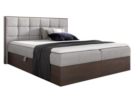 Klasyczne łóżko z beżową podstawą i głębokim zagłówkiem