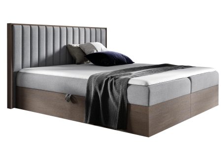 Tapicerowane łóżko w kolorze szarym z delikatnym przeszyciem