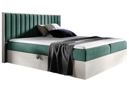 Tapicerowane łóżko w stylu loftowym z zielonym wezgłowiem i szufladą