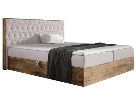 Jasnoróżowe łóżko z pikowanym zagłówkiem i ramą z naturalnego drewna