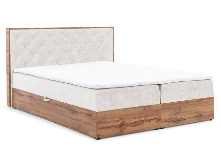 Beżowe łóżko tapicerowane z wysokim zagłówkiem i pojemnikiem