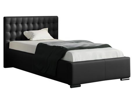 Czarne łóżko z guzikowym pikowaniem – styl bardziej klasyczny.