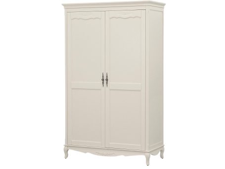 Klasyczna biała szafa z ozdobnymi frezami i wysokimi nóżkami