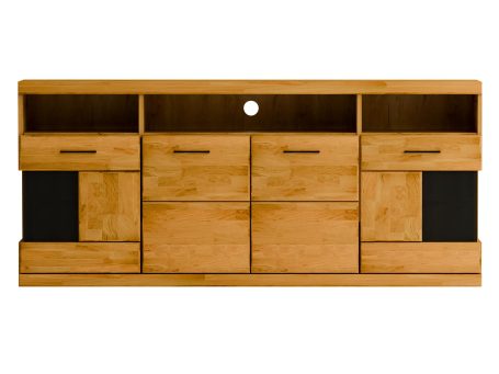 Niska szafka RTV z czarnymi frontami i półkami, tło z cegły