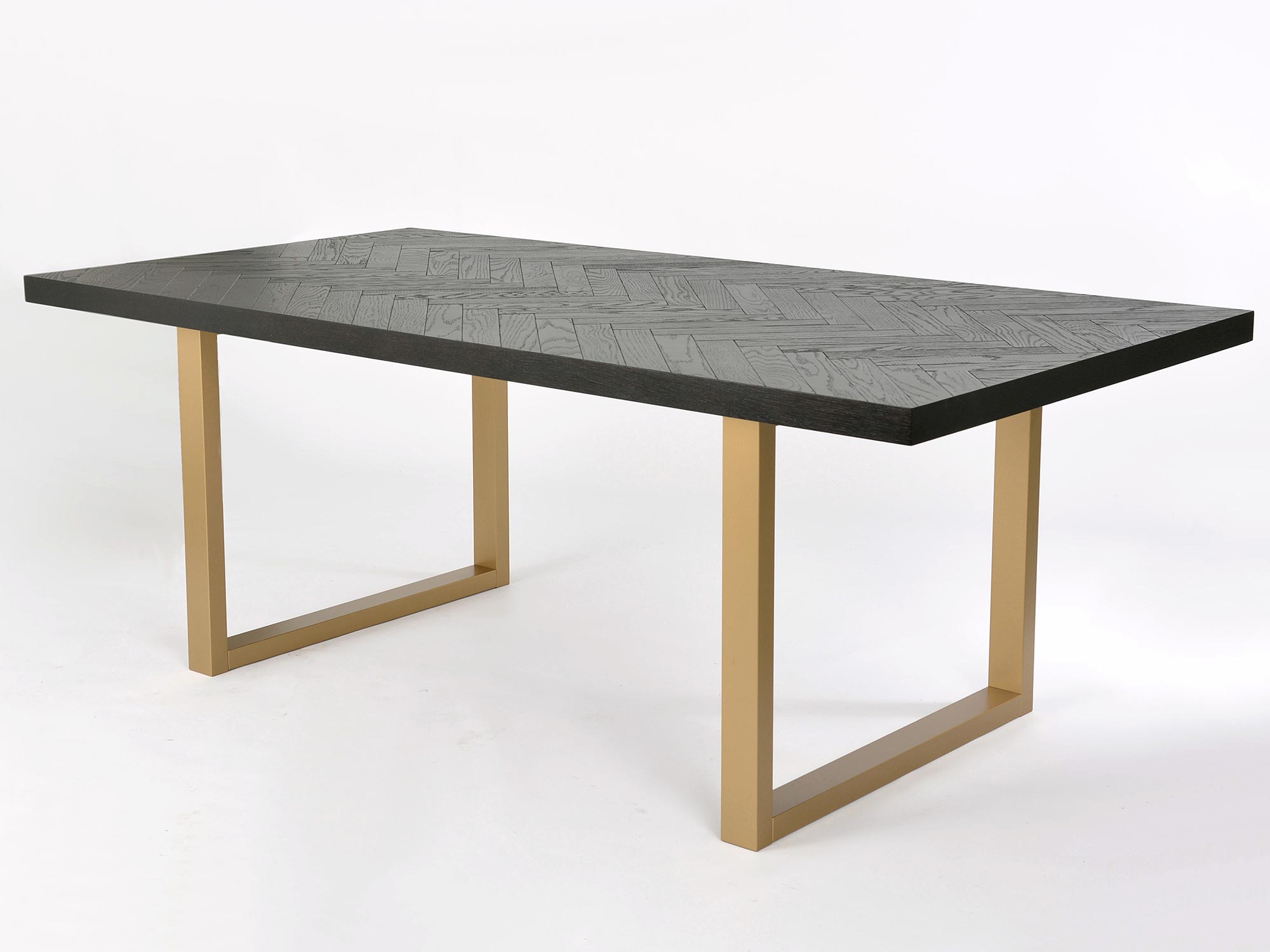 Nowoczesny stół prostokątny z czarnym blatem i złotymi nogami