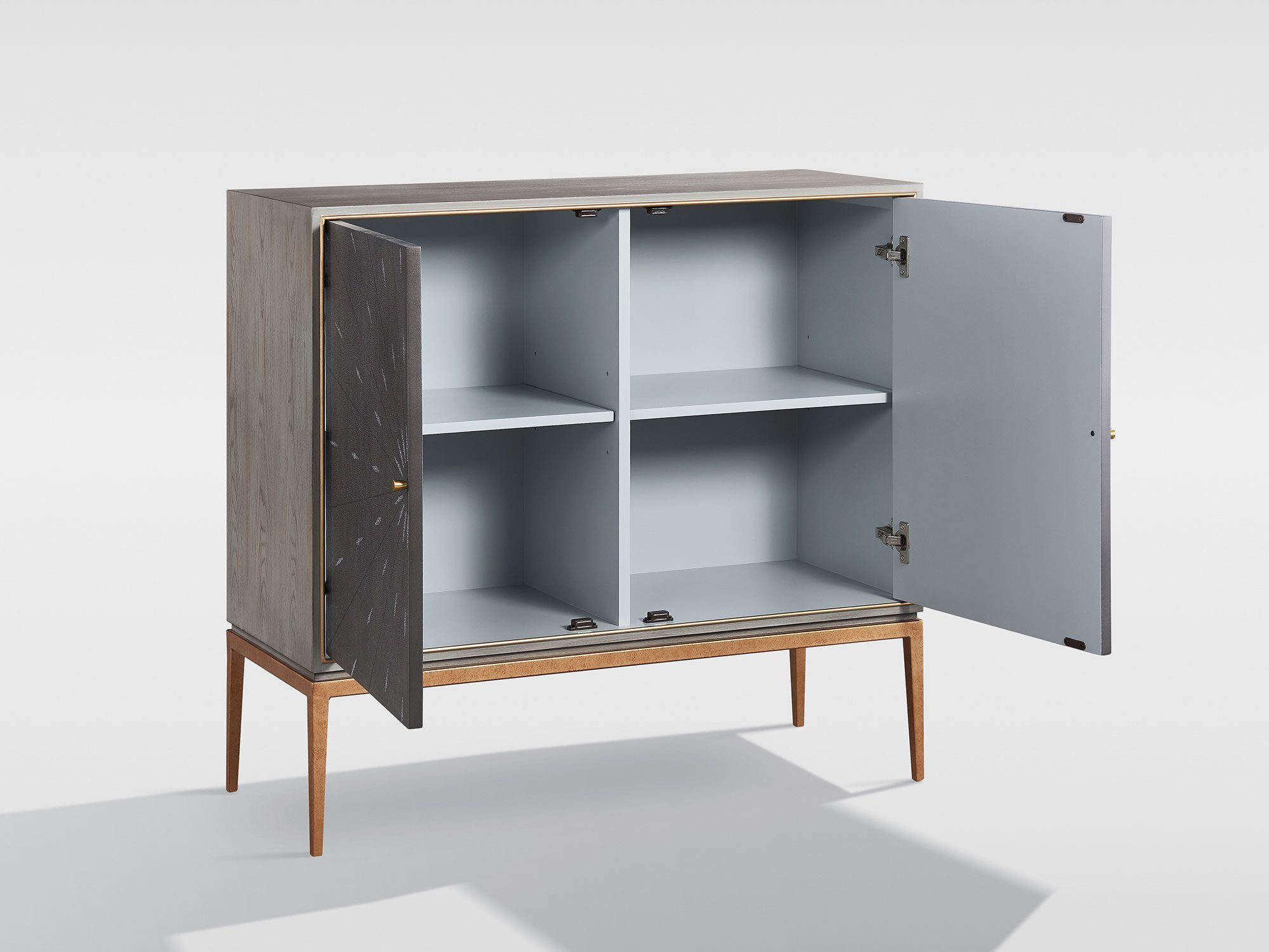 Nowoczesna szafka z dekoracyjnym frontem i złotą ramą