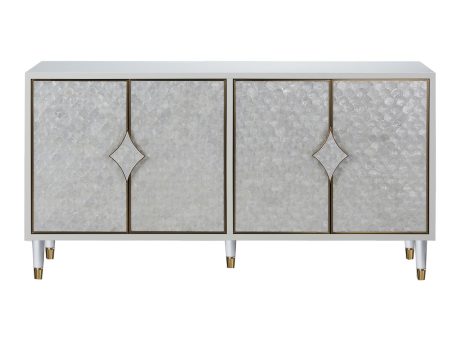 Komoda z eleganckimi frontami z naturalnej muszli na eleganckich biało-złotych nóżkach
