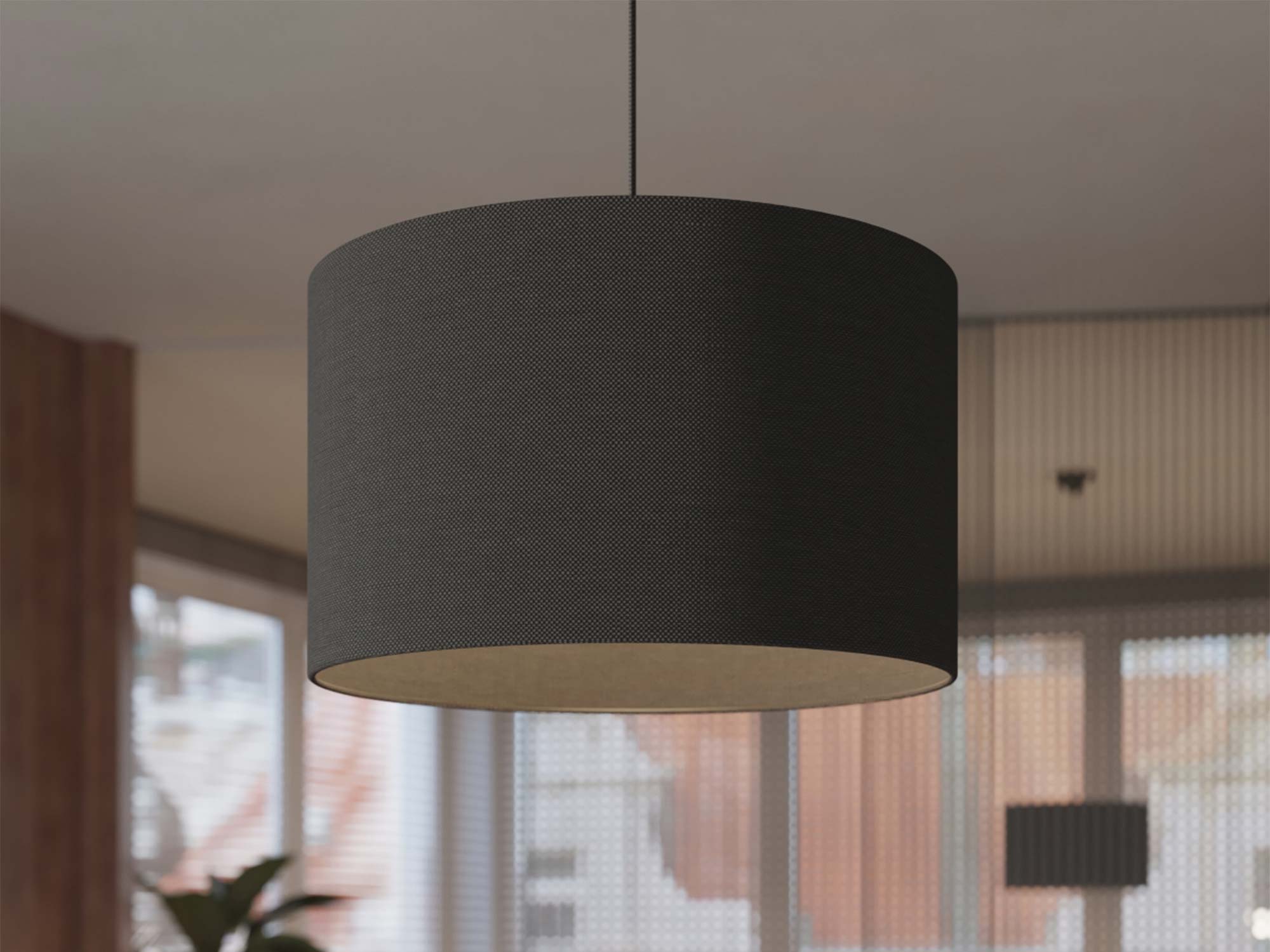 Lampa wisząca z czarnym cylindrycznym abażurem w aranżacji salonu zbliżenie