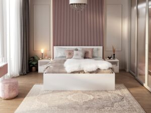 Miniaturka 5 - Zdjęcie przedstawia nowoczesną, elegancką sypialnię utrzymaną w stylu glamour z elementami minimalistycznymi. ### Kluczowe elementy wizualne: * **Paleta kolorystyczna:** Dominują odcienie brudnego różu (mauve), bieli, beżu oraz szarości. Akcenty złota i kryształu dodają wnętrzu luksusowego charakteru. * **Meble:** * Centralnym punktem jest białe, minimalistyczne łóżko o prostej bryle. * Po bokach znajdują się dopasowane, białe szafki nocne. * Po lewej stronie widoczny jest okrągły puf obity różowym aksamitem. * Po prawej stronie znajduje się duża szafa z lustrzanymi drzwiami przesuwnymi, która optycznie powiększa przestrzeń. * **Wykończenie ścian:** Ściana za łóżkiem została ozdobiona pionowymi lamelami w kolorze brudnego różu, flankowanymi przez jasne panele ścienne z delikatnym sztukateryjnym obramowaniem. * **Tekstylia i dodatki:** * Na łóżku znajduje się biała narzuta z futra oraz zestaw poduszek dekoracyjnych w kolorach różu i szarości. * Podłogę zdobi duży dywan z klasycznym, przecieranym wzorem (styl vintage/orientalny). * Z sufitu zwisa efektowny kryształowy żyrandol. * Wnętrze ocieplają dodatki: rośliny doniczkowe, świece, lampki nocne oraz wazony. * **Oświetlenie:** Pomieszczenie jest dobrze doświetlone naturalnym światłem wpadającym przez duże okno z lewej strony, uzupełnionym o ciepłe światło sztuczne z żyrandola i lampek. Wnętrze jest spójne, przytulne i zaprojektowane z dbałością o detale, łącząc nowoczesną prostotę z dekoracyjnymi akcentami.