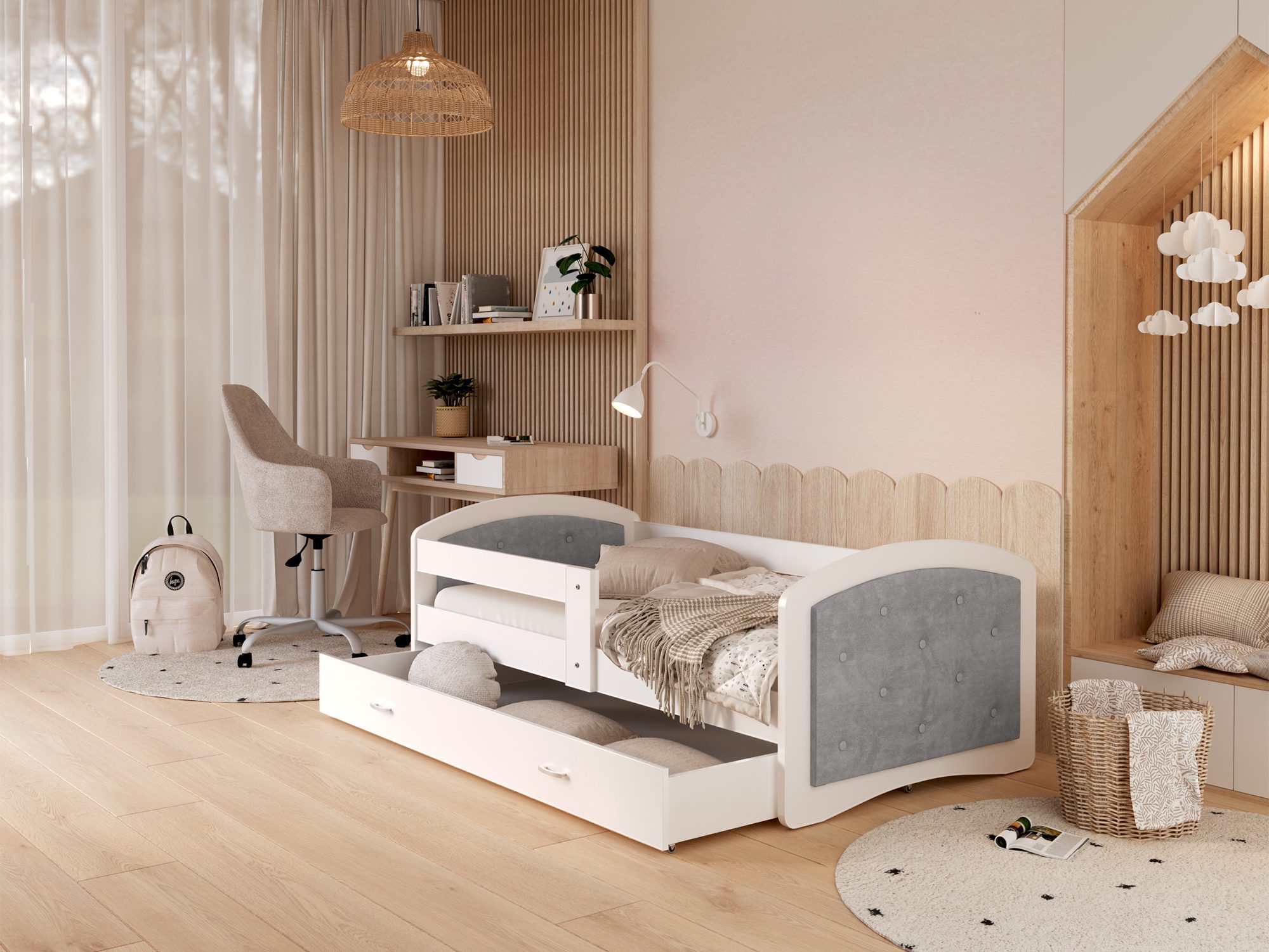 Graues Kinderbett mit gestepptem Kopfteil und offener Schublade im Zimmer Graues Kinderbett mit gestepptem Kopfteil und offener Schublade im Zimmer
