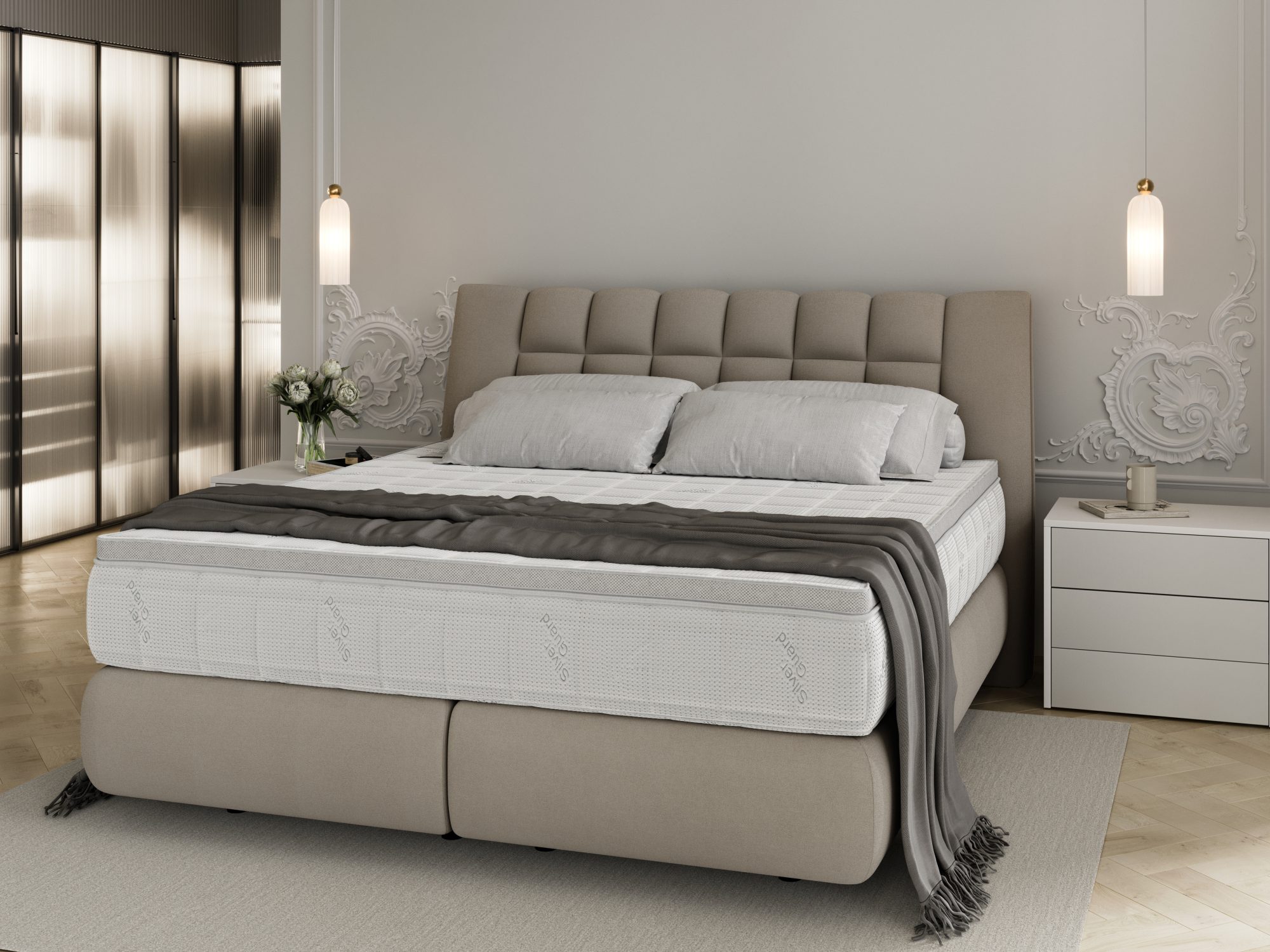 Boxspringbett Diunessa im hellen Schlafzimmer mit Nachttischen – Seitenansicht