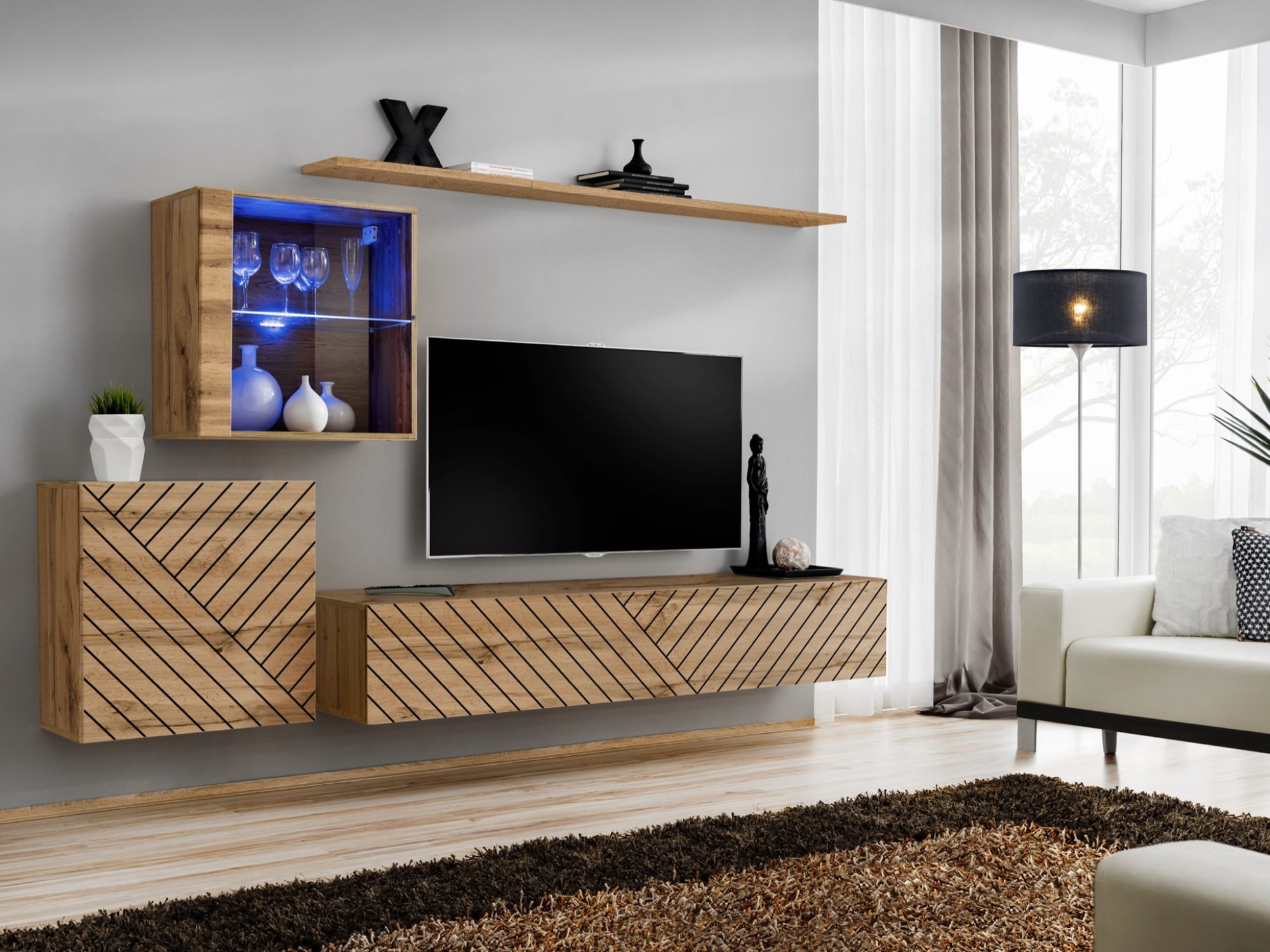 Wohnwand Kelmoro 260 cm mit geriffelten Fronten und Vitrine im Wohnzimmer-Arrangement